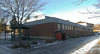 Gymnastikbyggnaden, entréfasad. 

SAK02039 Stockholm, Skärholmen, Falkholmen 3, Stångholmsbacken 91-95, från sydost (hus 5)