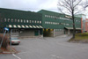 Skärholmen, Getholmen 1, Ekholmsv 30-40.

Fasad med lastkajer. Dem ljusgröna byggnadskroppen har byggts till under 1980-talet. 