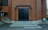 Huvudentrén till kyrkan. 
SAK12061 Sthlm, Kista, Danmark 3, Kista Torg 2, från NV













 







 


















