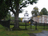 Kyrka, kyrkogård och kapell mot ösder. Kapell under renovering 2004.