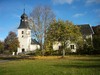 Regna kyrka och Rehnströmska skolan från sydväst.