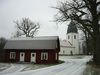 Östra Eds kyrka och gårdsbebyggelsen vid Åsvik, nordöst. 