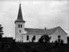 Vallby kyrka från söder. Fotot förmodas vara taget under perioden 1904 - 1906.
