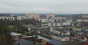 SAK01557 Stockholm, Sätra 2:3 mot sydost 
Vy mot sydost från vattentornet. I förgrunden syns radhusbebyggelsen, därefter tar den ljusputsade lamellhusbebyggelsen vid. Centrum markeras av de tre höga skivhusen.