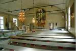 1949 års renovering innebar
att kyrkorummet fick en sen
1700-talskaraktär med sluten
bänkinredning och färgsättning
i grått.