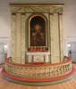 Altaruppsatsen, altaret och altarringen är från kyrkans byggnadstid 1860, men har målats om vid senare tillfällen. Altartavlan målades 1867