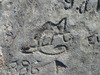 På planen framför kvarnmästarbostaden finns en berghäll där mjölnare under många år ristat in sina initialer. Bilden tillhandanhållen av ägaren.