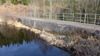 Intagsdammen som nedströms är byggd i sten har uppströms förstärkts med betong. Vattenspegeln inramas av en jordvall. 