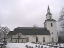 Säbrå kyrka med omgivande kyrkogård, vy från norr. 