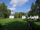 Graninge kyrka med omgivande kyrkogård samt klockstapel, vy från söder. 