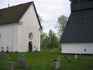 Torsåkers kyrka med omgivande kyrkotomt, samt del av klockstapel, vy från nordväst. 