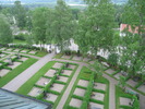 Selångers kyrka med omgivande kyrkogård, vy från tornet av södra kyrkogården. 
