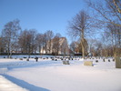 Grundsunda Kyrka med omgivande kyrkogård, samt klockstapel, vy från sydöst.