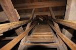 Äldre bjälkar har återanvänts i räcke till trapp upp i tornet från långhuset. Delarna är sannolikt medeltida takstolsdelar.