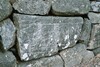Ristad sten i Bärebergs kyrkogårdsmur. Neg.nr. 04/164:20. JPG. 