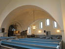 Kyrkorummet från nordväst. Långhusets kryssvalv tillkom i samband med korsarmarnas uppförande 1865.
