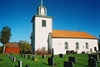 Marbäcks kyrka med omgivande begravningsplats, från SV.
