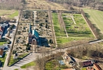Södra Åsums nya kyrka och kyrkogård sedd från öster