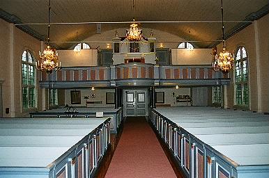 Långhuset i Mjöbäcks kyrka sett från koret mot orgelläktaren i väster, från Ö.