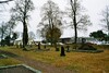Herrljunga kyrkogård med församlingshem och skola i bakgrunden. Neg.nr. B961_015:02. JPG. 
