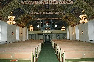 Långhuset i Skene kyrka sett från koret mot läktaren i väster, från Ö.